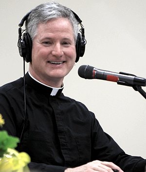 Father Rocky answers students’ questions on the air