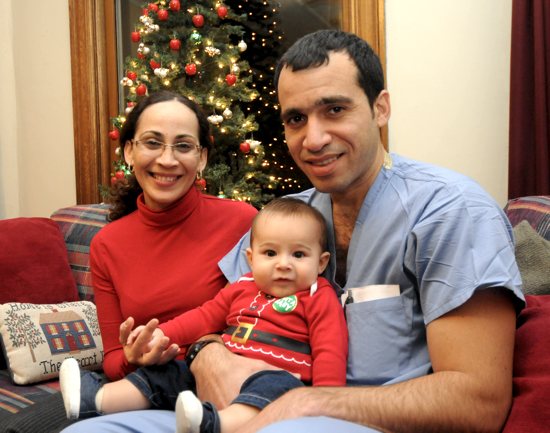 Yana Acosta and Berto Torres spend time at Casa Gualupana with their 5-month-old son Ricky. Dianne Towalski / The Catholic Spirit
