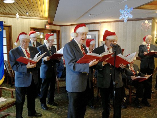 Members of the Minneapolis Knights of Columbus Male Chorus donned Santa hats for a Dec. 14 performance and sing-a-long for seniors at St. Therese Southwest Senior Care Community in Hopkins. Dianne Towalski / The Catholic Spirit