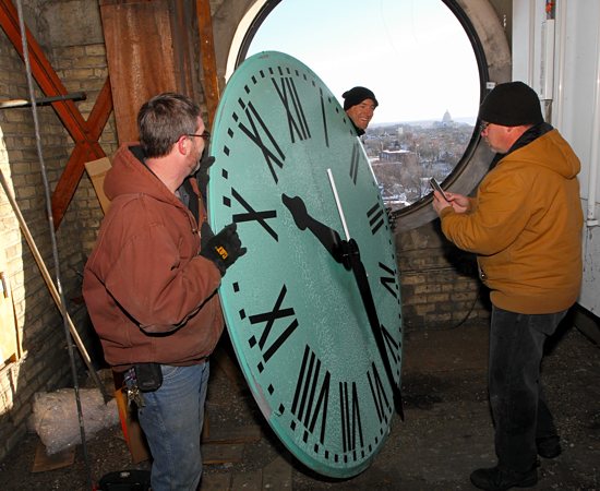 Three men stood on a precarious ledge about 150 feet above the ground inside the bell tower at St. Agnes in St. Paul just days before Christmas. Dave Hrbacek / The Catholic Spirit