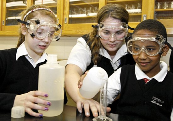 A robust science education is a crucial component of Visitation’s curriculum, as demonstrated by eighth-grader Joie Phelps, left, senior Claire Wendlandt and fifth-grader Abraham Yosef. Photo by Andy King