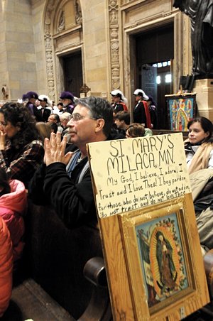 Steve Kintgen prays in the Cathedral before the prayer service. He is a member of St. Mary in Milaca, Minn. (Dianne Towalski/The Catholic Spirit)