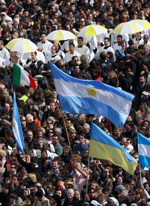 A man waves Argentina's flag as Pope Francis celebrates his inaugural Mass in St. Peter's Square at the Vatican March 19. CNS photo/Paul Haring