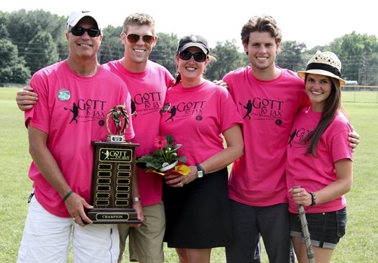 From left, Steve, Tyler, Lisa, Ryan and Rachel Gott hold the championship trophy for the lacrosse tournament in honor of Adam, the son of Steve and Lisa who died in a motorbike accident last summer. The tournament was held at Hill-Murray High School in Maplewood July 13 and 14. Photo by Lori Wietecki / Special to The Catholic Spirit