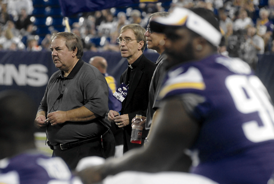 Minnesota Vikings chaplain Father Michael Van Sloun, center, watches the last preseason game from the sideline at the Metrodome in Minneapolis Aug. 29. Father Van Sloun has been one of two chaplains to the team since 2002. Dianne Towalski / The Catholic Spirit