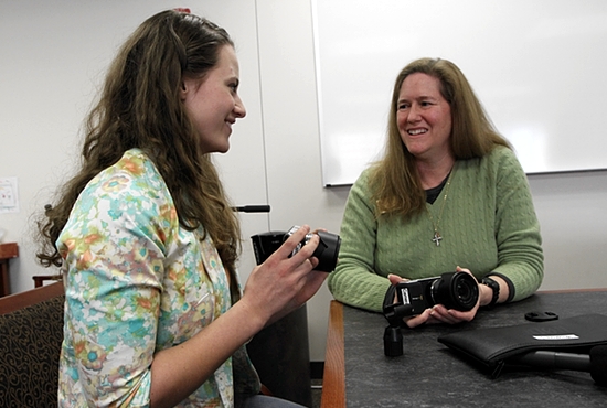 St. Catherine University sophomore Laura Crepeau, left, talks about her National Catholic Sisters Week video project with Dominican Sister Mary Soher, co-director of the initiative, made possible by a three-year, $3.3 million grant from the Hilton Foundation. Dave Hrbacek / The Catholic Spirit