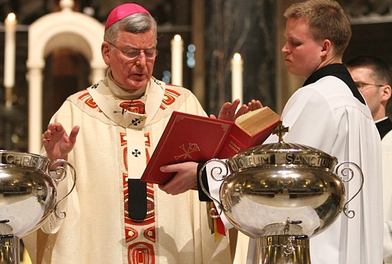 Archbishop John Nienstedt prays during the blessing of the oil of catechumens and consecration of chrism near the end of the 2013 Chrism Mass at the Cathedral of St. Paul. Dave Hrbacek / The Catholic Spirit