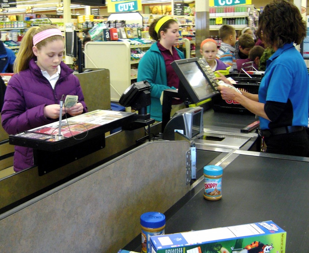 More than 100 seventh- and eighth-grade students from St. Hubert School in Chanhassen spent March 12 at Cub Foods purchasing items to donate to People Reaching Out to Other People, a local food shelf and multi-service organization serving the Chanhassen and Eden Prairie area.  The project is a part of St. Hubert's larger social justice curriculum. The students partnered with People Reaching Out to Other People to better understand food costs and how providing food for a family impacts people with no or limited incomes. The students had to earn the money themselves outside of school and try to stretch their $10 to $20 budget by finding coupons.   