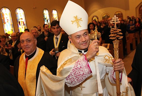 Chorbishop Sharbel Maroun, pastor of St. Maron Maronite Rite Catholic Church in Minneapolis, blesses the congregation during his ordination Mass Jan. 6 at St. Maron. Performing the ordination rite was Bishop Elias Zaidan of Our Lady of Lebanon of Los Angeles. Bishop Lee Piché attended the ordination, along with several other priests of the Archdiocese of St. Paul and Minneapolis, including Msgr. Aloysius Callaghan, rector of the St. Paul Seminary School of Divinity in St. Paul. Chorbishop Maroun, who previously held the title of monsignor, will continue to serve as pastor of St. Maron, which he has done since being appointed there in 1989. The ordination also was special for Chorbishop Maroun because it was his 53rd birthday. Dave Hrbacek/The Catholic Spirit