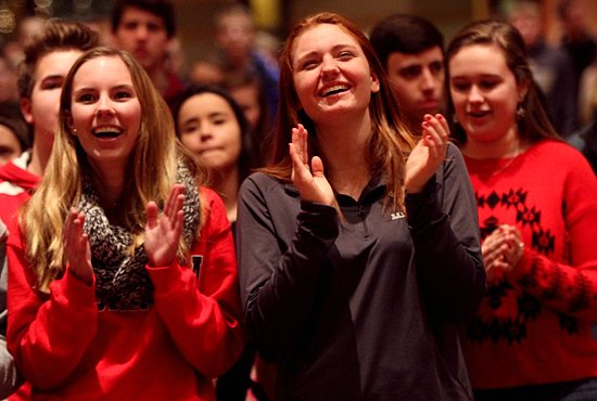 From left, Olivia Kettleson and Abbey Baumtrog sing and clap during praise and worship at Holy Name of Jesus in Wayzata Jan. 11 during an event to help teens in the parish prepare for confirmation. The featured speaker was Father Michael Schmitz of the Diocese of Duluth, who also celebrated the 5:30 p.m. Mass. Dave Hrbacek/The Catholic Spirit