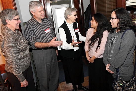 Tom Bengtson of Holy Family in St. Louis Park visits the Visitation Monastery of Minneapolis Feb. 8 with his daughters Paula, second from right, and Catherine. They are talking with Visitation Sisters Mary Frances Reis, left, and Karen Mohan. Dave Hrbacek/The Catholic Spirit