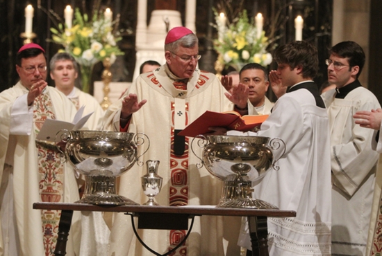 Archbishop John Nienstedt prays the Blessing of the Oil of Catechumens and Consecration of Chrism near the end of the Chrism Mass March 27 at the Cathedral of St. Paul. The annual liturgy features the consecration of holy chrism and blessing of other oils — the oil of catechumens and the oil of the sick. The Mass also includes the Renewal of Commitment to Priestly Service, in which priests of the archdiocese renew their dedication to the Church through a life of sacrifice, devotion and love. Dave Hrbacek/The Catholic Spirit