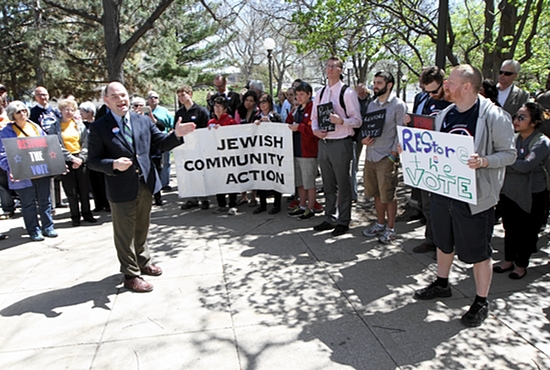 Jason Adkins of the Minnesota Catholic Conference delivers remarks April 29 at a Restore the Vote rally at the State Capitol, supporting a bill that would allow convicted felons voting rights after incarceration. Dave Hrbacek/The Catholic Spirit