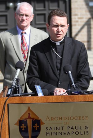 Bishop Andrew Cozzens speaks during a press conference outside of the chancery. Behind him is Tim O'Malley, director of ministerial standards and safe environment. Dave Hrbacek/The Catholic Spirit
