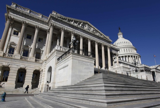 The U.S. Capitol dome is seen behind the entrance to the House of Representatives on Capitol Hill in Washington. During his Sept. 22-27 visit to the United States, Pope Francis will address a joint meeting of Congress Sept. 24, becoming the first pope to do so. CNS /Larry Downing, Reuters
