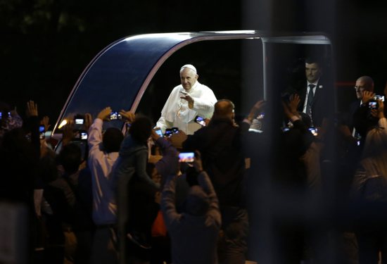 Pope Francis waves to crowds along Benjamin Franklin Parkway as he arrives for the Festival of Families for the World Meeting of Families in Philadelphia Sept. 26. CNS