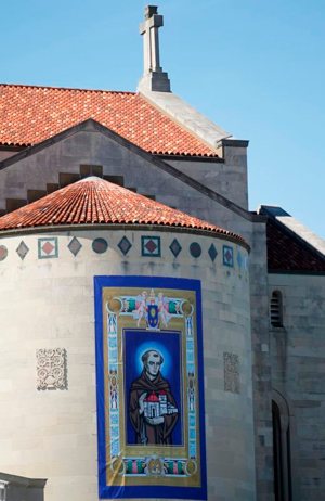 A banner displays an image of Blessed Junipero Serra at the Basilica of the National Shrine of the Immaculate Conception in Washington Sept. 23 just ahead of his canonization by Pope Francis. CNS photo/Bob Roller