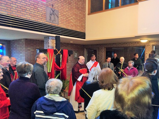 Father Anthony Criscitelli and Deacon Rich Heineman lead the Palm Sunday liturgy at St. Bridget in north Minneapolis.