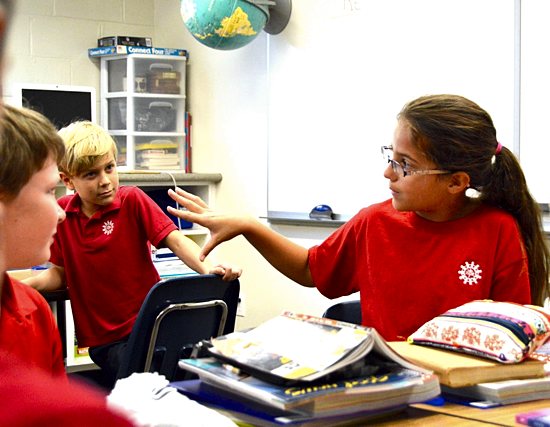 Fourth-grader Maggie Kramer joins a class discussion at St. Michael School in St. Michael. Bob Zyskowski/The Catholic Spirit