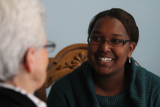 Monica Ngeno talks with Sister Katherine Mullin, vocations director for the Visitation Monastery of Minneapolis. Ngeno is working with the Eagan-based Labouré Society to raise money to pay off her student loan so that she will be debt free and able to join the Visitation Sisters. Dave Hrbacek/The Catholic Spirit