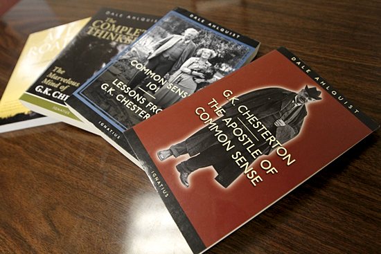 A stack of books he wrote sits on a table in his office at the school. Dave Hrbacek/The Catholic Spirit