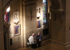 A priest hears a confession at the Basilica of St. Mary in Minneapolis March 4 at the start of 24 Hours for the Lord. Dave Hrbacek/The Catholic Spirit