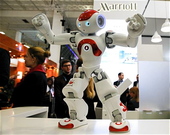 A Zora Bots humanoid robot dances at the Marriott exhibition stand on the International Tourism Trade Fair in Berlin March 9. Rapidly emerging fields of artificial intellgence and machine learning are posing challenges to what it means to be human.