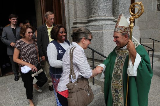 Archbishop-designate Bernard Hebda greets people outside the Cathedral of St. Paul July 12, 2015, at the end of his first Mass in the Archdiocese of St. Paul and Minneapolis. Dave Hrbacek/The Catholic Spirit