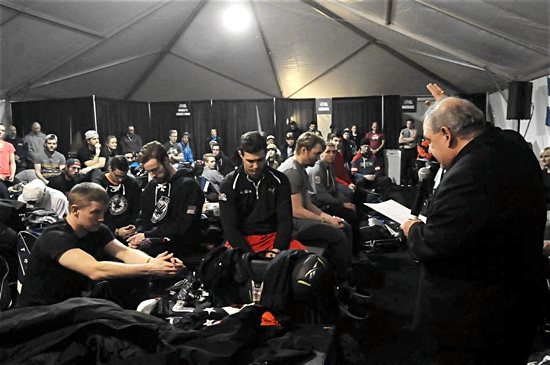 Archbishop Bernard Hebda blesses athletes before Red Bull Crashed Ice’s Ice Cross Downhill World Championship  Feb. 27 at the Cathedral of St. Paul in St. Paul. Dianne Towalski/For The Catholic Spirit