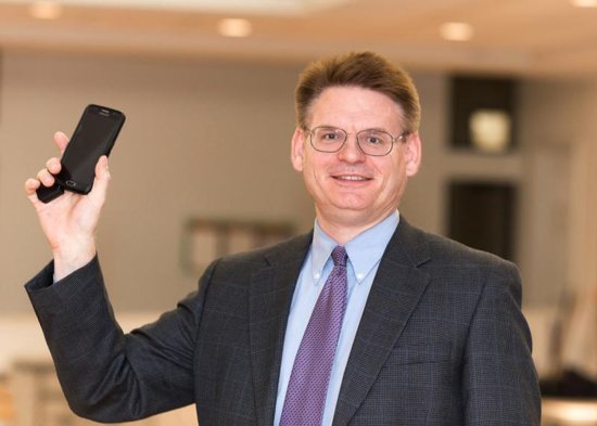 Clinical and family therapist Peter Kleponis of the Philadelphia area poses for a photograph with his cellphone during his workshop on Internet pornography and addictions March 7 at St. Gregory the Great Parish in Ft. Lauderdale, Fla. CNS photo/Tom Tracy