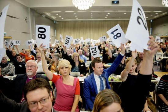Church leaders and other officials vote April 11 on gay marriage within the Norwegian Church in Trondheim, Norway. A Norwegian bishop said the country's clergy will no longer officiate at civil weddings, after the predominant Lutheran Church's governing synod voted to conduct gay marriages in Norway. CNS photo/Ole Martin Wold, EPA