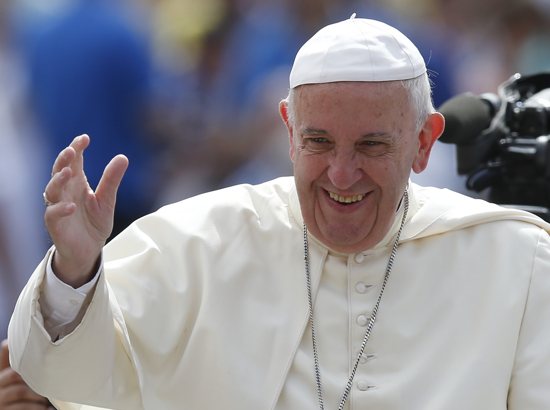 Pope Francis greets the crowd during his general audience in St. Peter's Square at the Vatican June 15. CNS