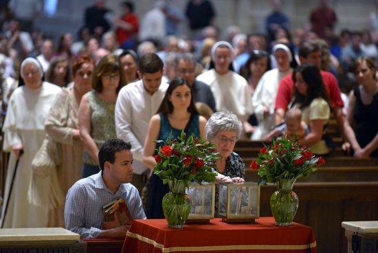 Catholics venerate the relics of Sts. Thomas More and John Fisher at the Cathedral of St. Paul in St. Paul June 26 as part of the relics' U.S. "Strength of the Saints" tour. Jim Bovin/For The Catholic Spirit