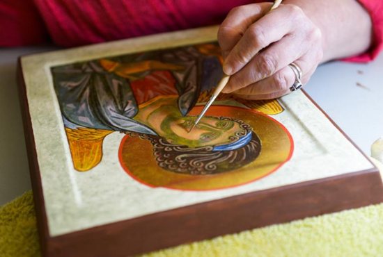 Marianist Brother Gary Marcinowski, a professor of sculpture at the University of Dayton, adds detail to an icon he created during a weeklong workshop on the ancient art form at the Shrine of St. Anthony in Ellicott City, Md., April 25. CNS photo/Kevin J. Parks, Catholic Review