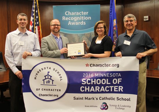 St. Mark's School Principal Zach Zechser, second from left, receives the 2016 Minnesota School of Character Award May 26 on behalf of the pre-kindergarten to eighth-grade school. Courtesy St. Mark's School