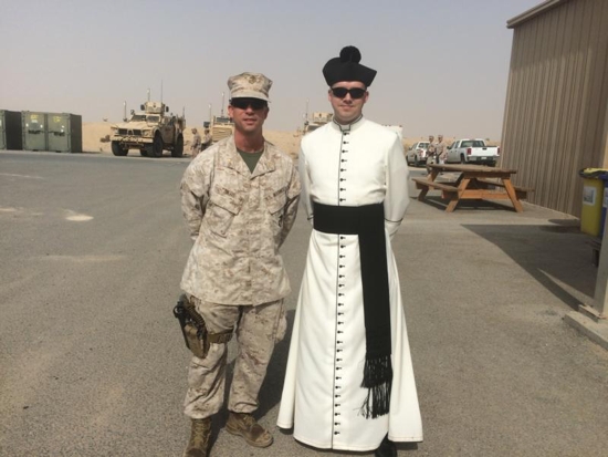 Father John Reutemann poses for a photo Oct. 18, 2015, with an unidentified major in the U.S. Marine Corps at Ahmed Al Jaber Air Base in Kuwait. Father Reutemann had been deployed to the combat zone as a chaplain in the U.S. Air Force. CNS photo/courtesy Father John Reutemann