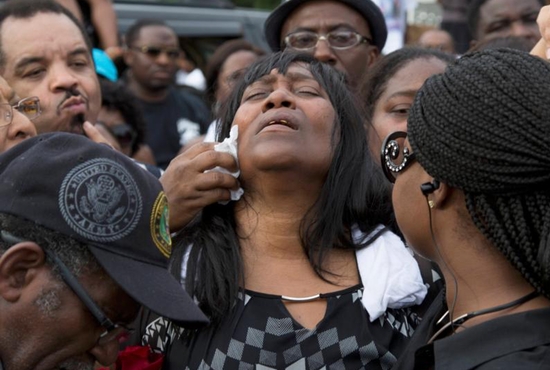 Sandra Sterling reacts during a July 7 vigil in memory of her nephew, Alton Sterling, who was shot dead by police outside a market in Baton Rouge, La. Sterling, 37, was killed early July 5 in a shooting that was captured on cellphone video. CNS photo/Jeffrey Dubinsky, Reuters