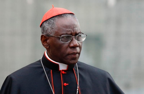 Cardinal Robert Sarah, prefect of the Congregation for Divine Worship and the Sacraments, is pictured at the Vatican in this Oct. 9, 2012, file photo. Cardinal Sarah, the Vatican's liturgy chief, has asked priests to begin celebrating the Eucharist facing east, the same direction the congregation faces. Although not commonplace, the practice is already permitted by church law. Cardinal Sarah made his request during a speech at the Sacra Liturgia conference in London July 5. CNS photo/Paul Haring