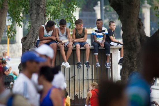 Boys wait for Pope Francis' arrival at the Father Felix Varela Cultural Center in Havana Sept. 20, 2015. To help young Cubans who could not afford the trip to World Youth Day in Krakow, Poland, feel more connected to the international gathering in Europe, the pope sent a video message to Havana. CNS photo/Tyler Orsburn