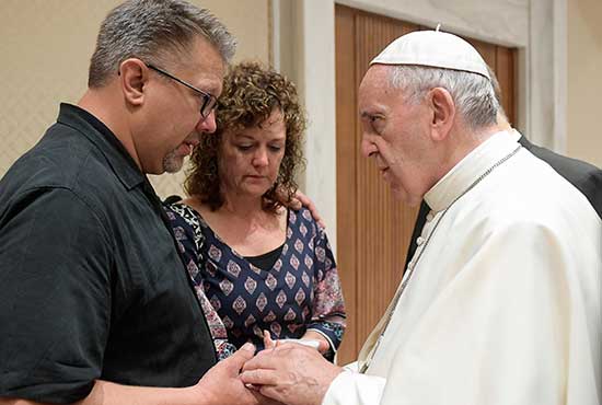 Pope Francis talks with Nick and Jodi Solomon, parents of U.S. student Beau Solomon, during a private meeting at the Vatican July 6. Solomon, a native of Spring Green, Wis., was found dead in the Tiber River in Rome July 4. A homeless man was detained as a suspect in the death. CNS