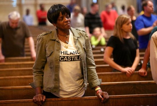 Sharon James-Abba of St. Paul listens to Archbishop Bernard Hebda during Mass for the Preservation of Peace and Justice at the Cathedral of St. Paul July 8. Dave Hrbacek/The Catholic Spirit