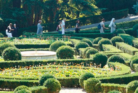Tourists walk through the Vatican Gardens in this Sept. 15, 2011, file photo. The Vatican Gardens have evolved over the centuries from wild fields and vineyards to formal manicured plots. CNS photo/Paul Haring