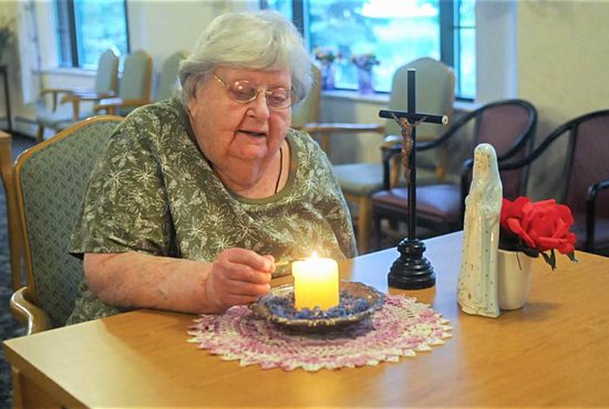 Agnes Imdieke of Albany, Minn., pictured Sept. 6, has been lighting a candle for Jacob Wetterling every morning since he disappeared in October 1989. A Minnesota man confessed to kidnapping and killing the boy Sept. 6. CNS photo/Dianne Towalski, The Visitor