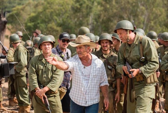 Director Mel Gibson, center, is seen on the set of "Hacksaw Ridge." The movie marks Gibson's return to the director's chair after a 10-year absence. CNS photo/Lionsgate