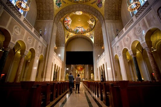 Tourists are seen at the Basilica of the National Shrine of the Immaculate Conception in Washington Oct. 6. The mosaic ornamentation of the interior of the dome is scheduled for a December 2017 completion. CNS photo/Tyler Orsburn