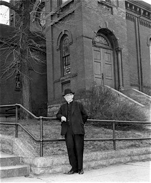 Father John O’Neill, a longtime pastor of St. Michael pictured in front of the parish’s West Side church in 1966, moved the parish from St. Paul’s West Side to West St. Paul in the 1950s. Photo courtesy the Pioneer Press