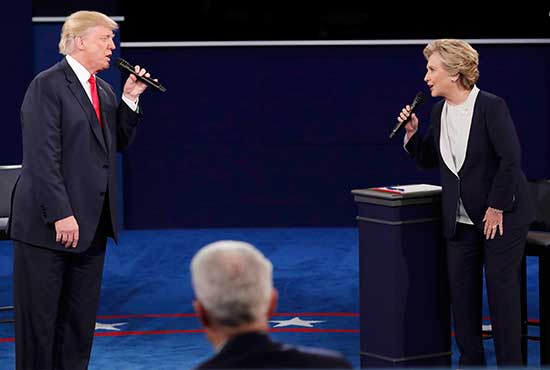 Republican U.S. presidential nominee Donald Trump and Democratic presidential nominee Hillary Clinton speak during their Oct. 9 presidential town hall debate at Washington University in St. Louis. CNS/Jim Young, Reuters
