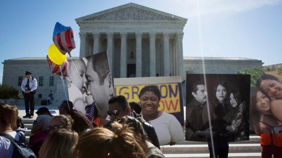 Supporters of the Deferred Action for Childhood Arrivals program, known as DACA, are seen outside the U.S. Supreme Court in Washington April 18. More than 70 presidents at Catholic colleges and universities have signed a statement pledging their support for students attending their schools who are legally protected by DACA. CNS photo/Tyler Orsburn