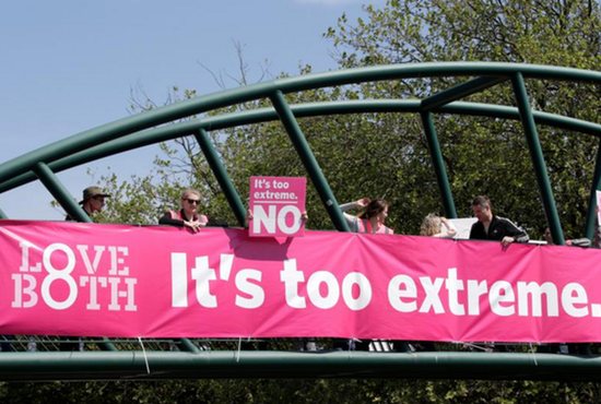 Protesters hold up banners on a bridge in Dublin to persuade voters as Ireland holds a referendum on its law on abortion.