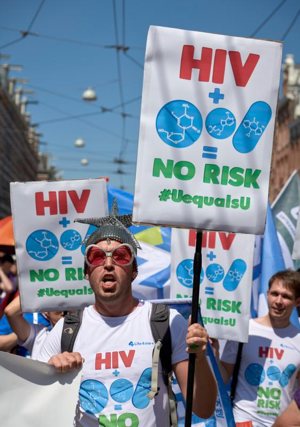 Participants march July 23 through the streets of Amsterdam, marking the opening of the 2018 International AIDS Conference.